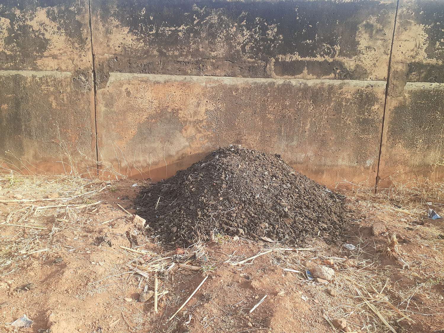 Organic compost being prepared from farm and household waste