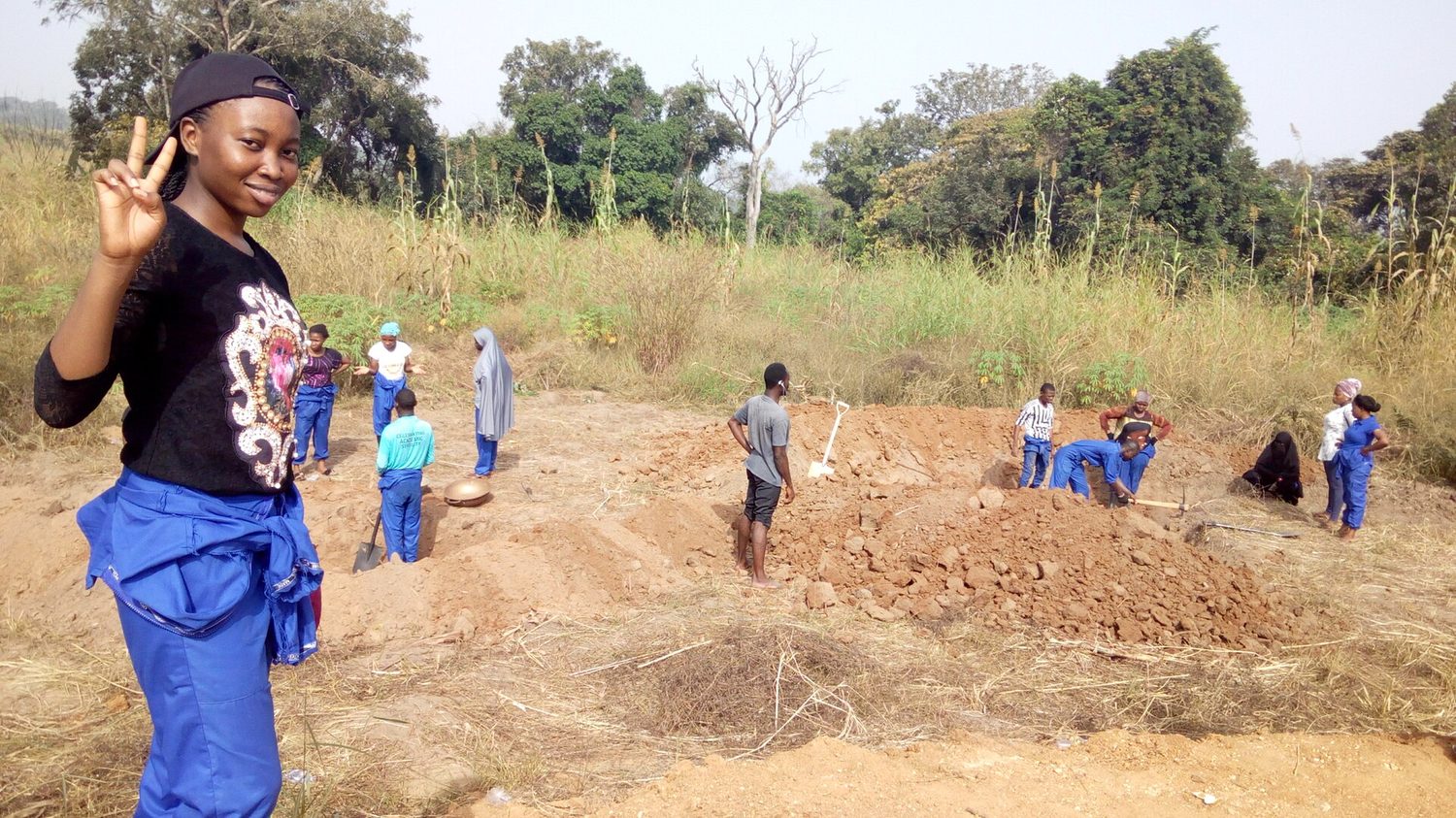 Fish pond excavation and liner work at a farm site
